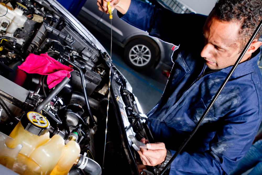 Mechanic fixing a car at the garage